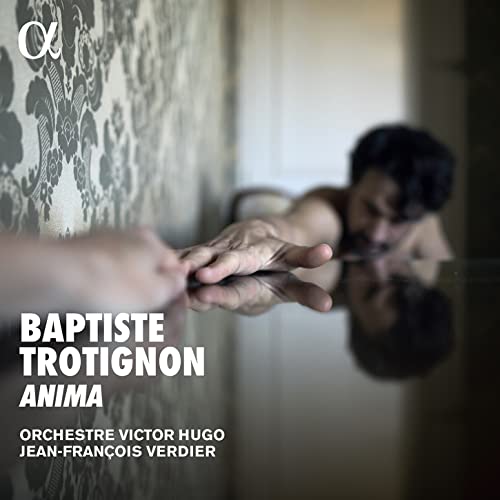 CD cover: man reaching towards a hand reflected in a mirror.
