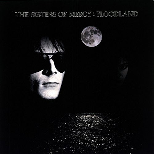 The image is a vinyl album cover with two faces and a moon.