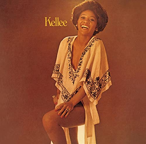 Kellee Patterson album cover: smiling Black woman in embroidered top.