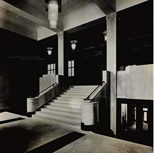 "Black and white image of a staircase with marble steps and railings."