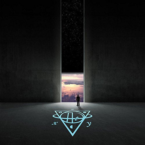 The image depicts a vinyl record cover. Alt text: Vinyl record cover with a person standing in a dark room.