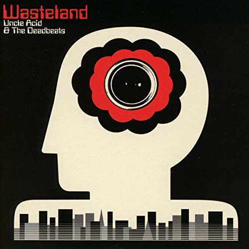 Wasteland" album cover: stylized head with flower eye over a cityscape.