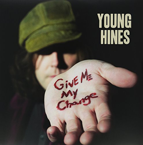 "Album cover with a person holding out hand with 'Give Me My Change' written on it."