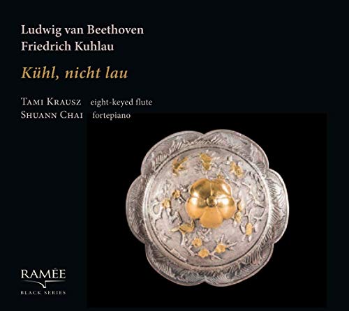 A CD cover featuring a decorative silver plate with gold accents on a black background.