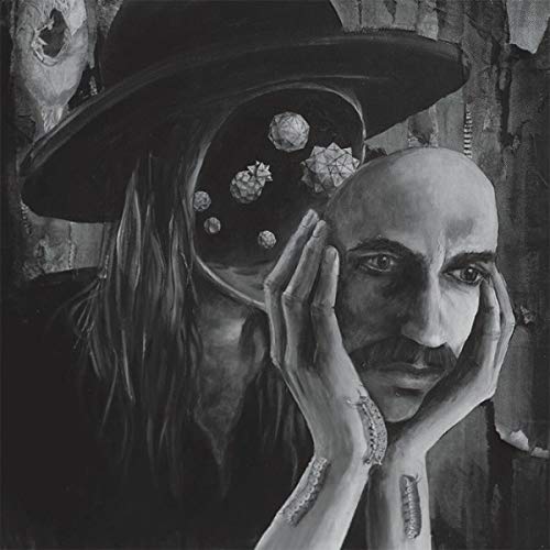 "Black and white CD cover art featuring a man with a hat and skull imagery."