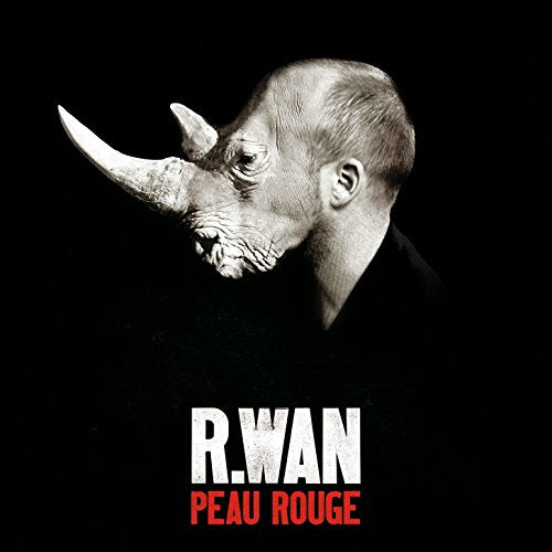 Black and white portrait of a man with a rhinoceros head.