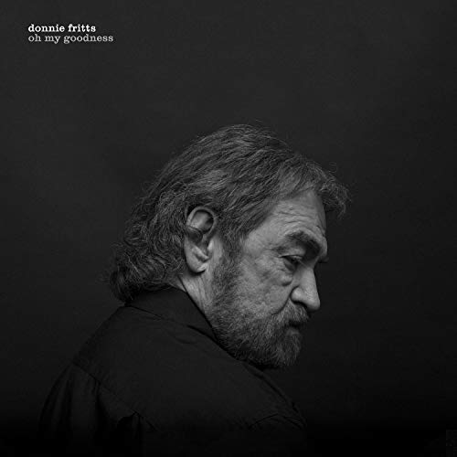 Black and white portrait of Donnie Fritts, looking downward.
