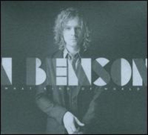 Black and white album cover with a man in a suit, text overlay.