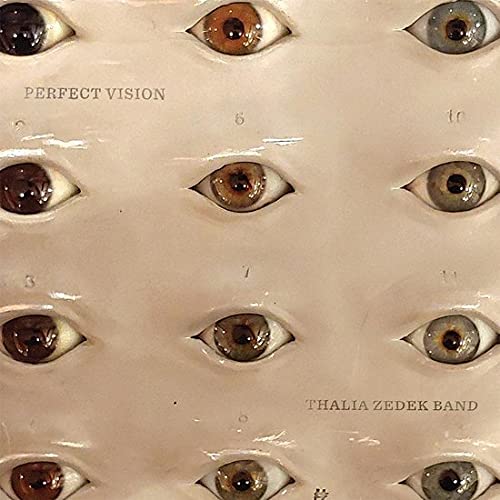 Album cover with a grid of realistic, colorful human eyes.
