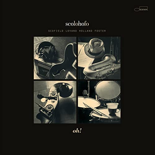 Black and white album cover featuring musical instruments and headphones.