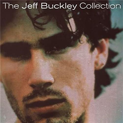 Close-up portrait of Jeff Buckley with dark hair and shadowed eyes.