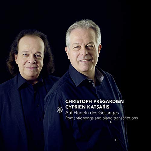 "CD cover featuring two men in dark attire against a black background."