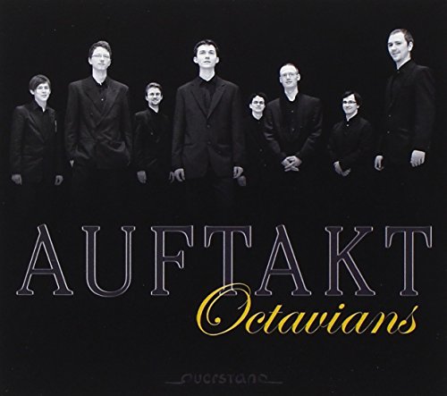 "Album cover featuring eight people in black attire against a black background."