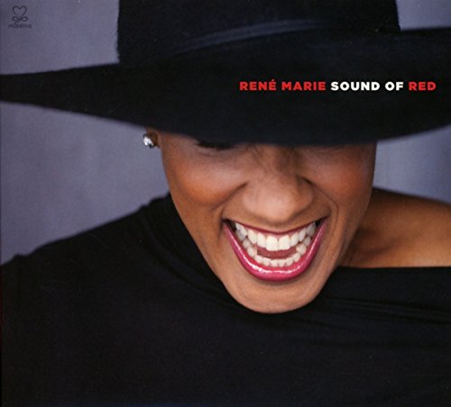 René Marie smiling broadly, wearing a black hat, album cover.