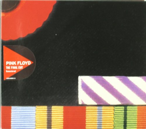 "CD case with red disc and black background, partially visible multicolored ribbon."