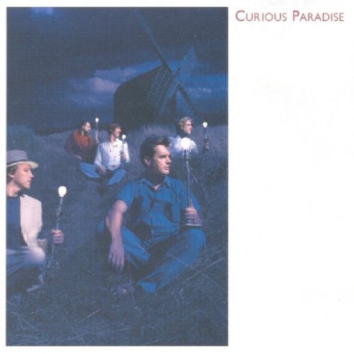 "Album cover with men holding candlesticks in a field with a windmill."