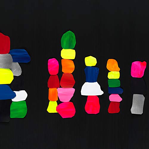 Stacks of colorful, abstract paint swatches arranged against a textured black background.