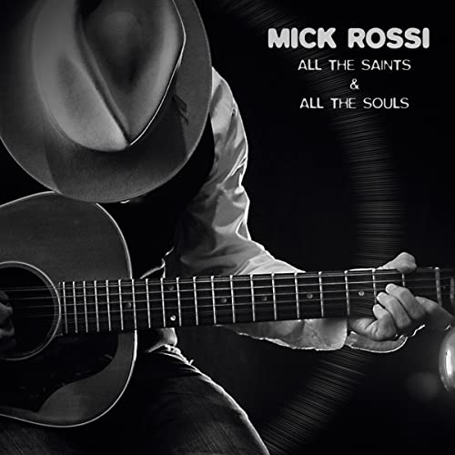 Black and white album cover featuring a man with a cowboy hat and guitar.