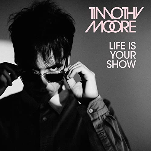 Black and white portrait of Timothy Moore with sunglasses, album cover.