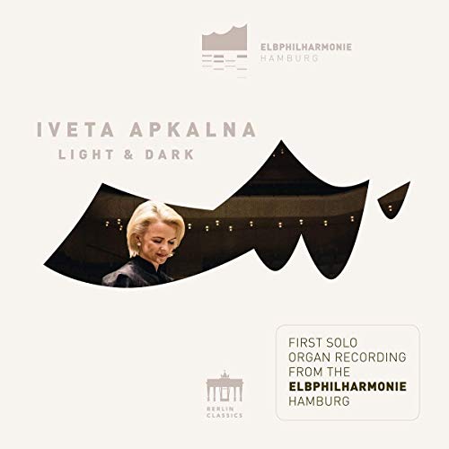 Iveta Apkalna's album cover featuring a blonde woman in a dark organ loft.