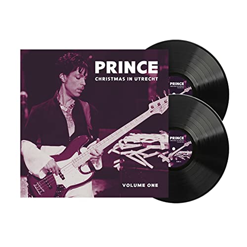 Prince playing guitar on album cover with two black vinyl records.
