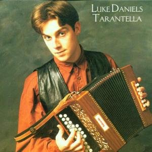 Man holding accordion, wearing red shirt and black vest, against a green background.