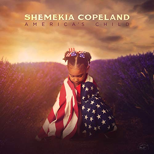 "Album cover featuring a young girl wrapped in an American flag, outdoors."