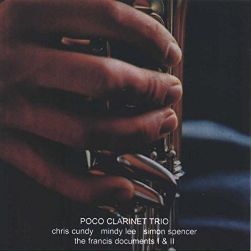 "CD cover featuring a close-up of hands playing a clarinet with white text."
