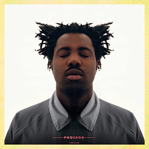 Sampha album cover: close-up of a Black man with textured hair, eyes closed.