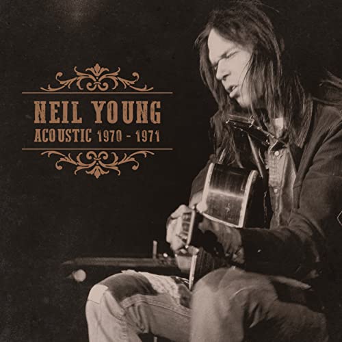 Neil Young playing acoustic guitar, sepia-toned album cover.