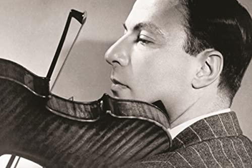 Black and white portrait of violinist Nathan Milstein playing.