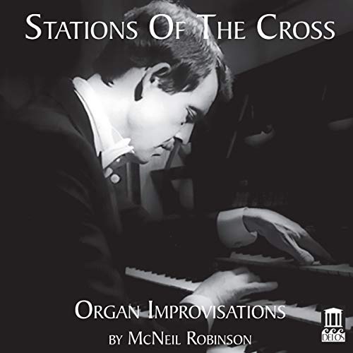 A black and white image of a man playing an organ.