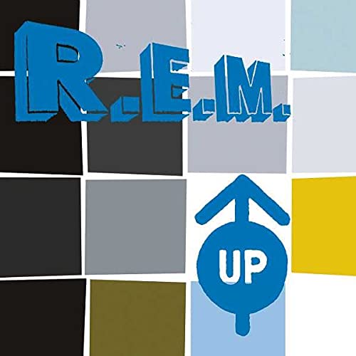 R.E.M. album cover "Up" with blue lettering and an arrow symbol.