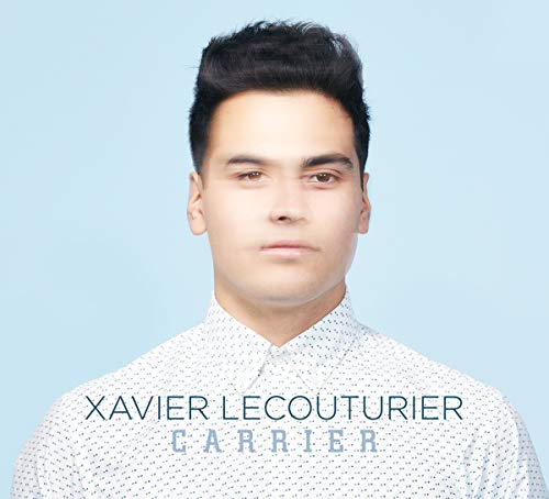"Album cover with a man in a white shirt against a light blue background."