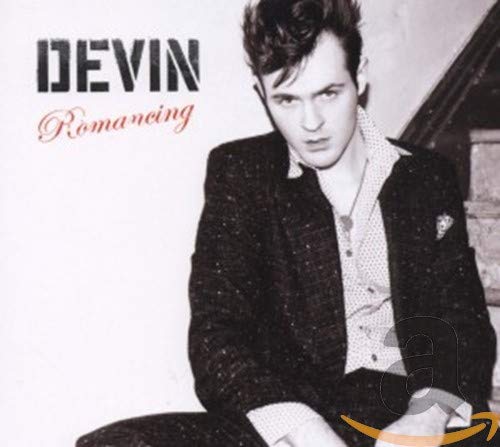 Black and white CD cover featuring a young man in a jacket.