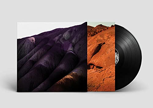 Vinyl record with album cover depicting a textured, purple and orange landscape.