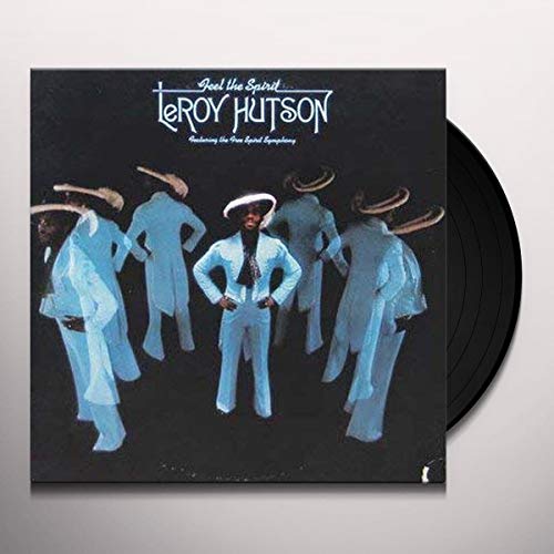 Leroy Hutson album cover with musicians and a vinyl record beside it.
