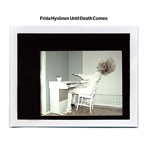 Album cover: woman with hair flying, seated at a piano.