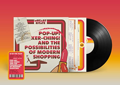 Vinyl record with colorful album cover featuring text and a lipstick graphic.