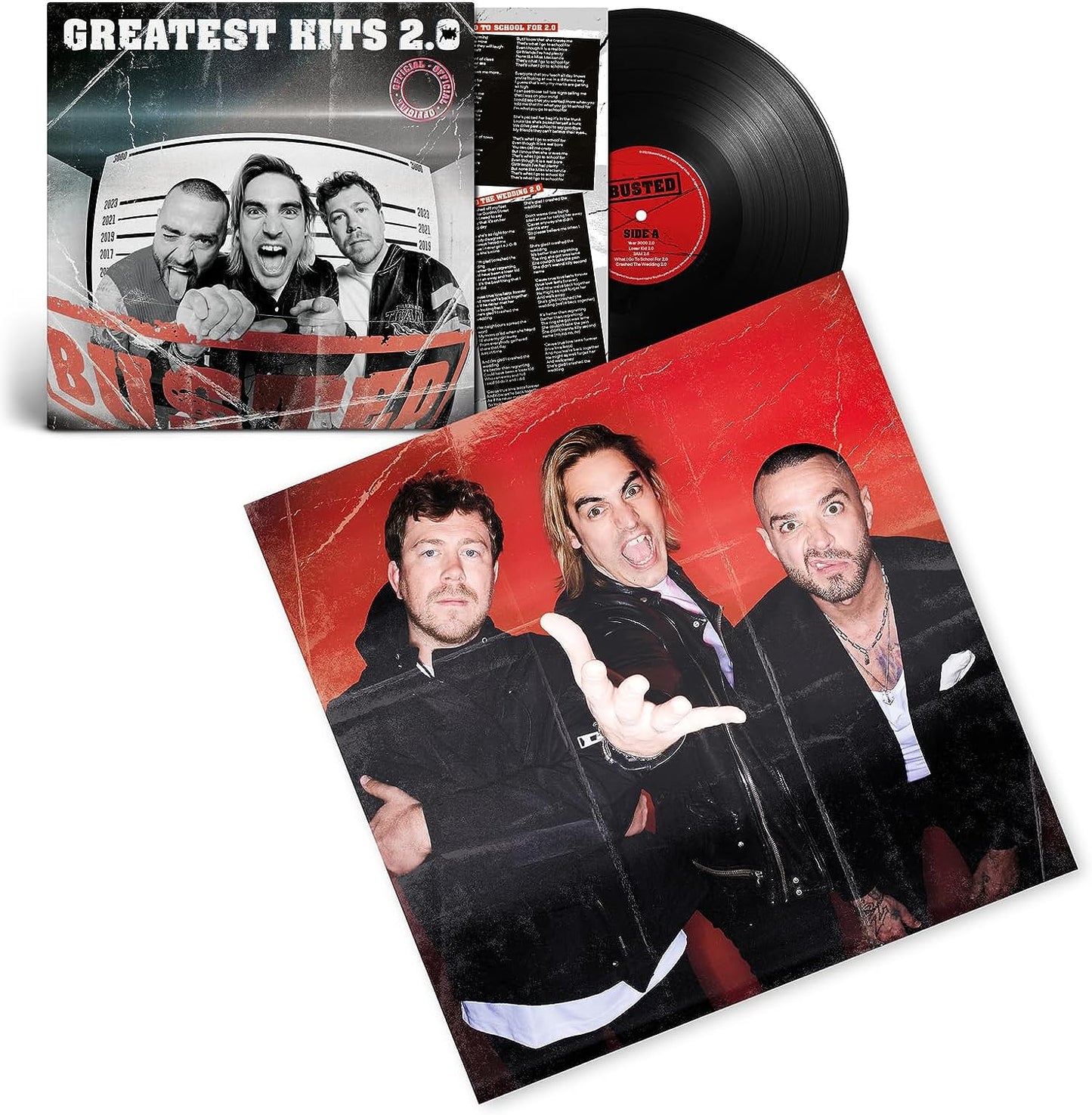 "Vinyl record and album cover featuring the band Busted with three male members."