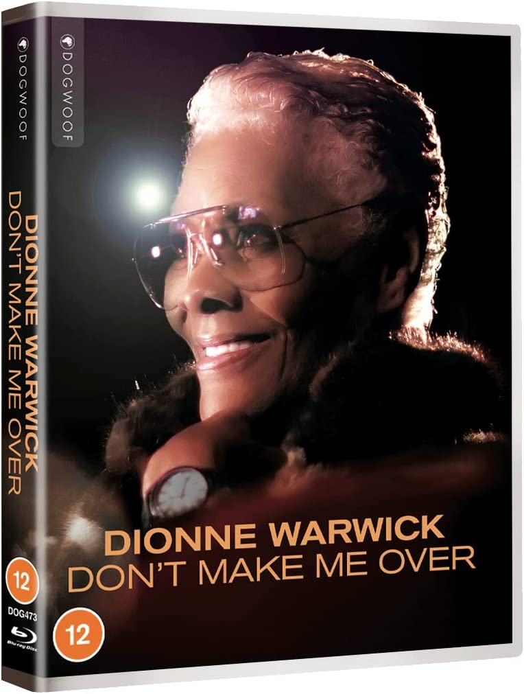Dionne Warwick smiling, wearing glasses and a fur stole, Blu-ray cover.