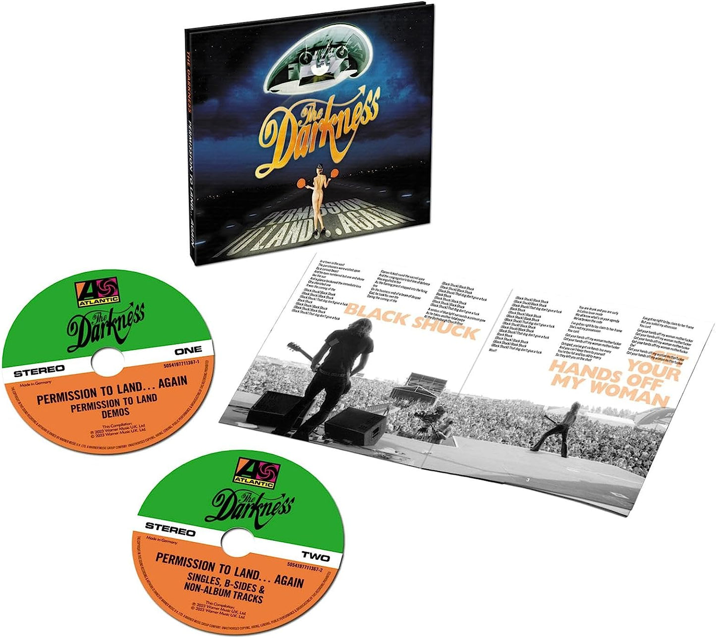 "CD case and two discs with booklet, The Darkness album artwork featuring UFO and man."