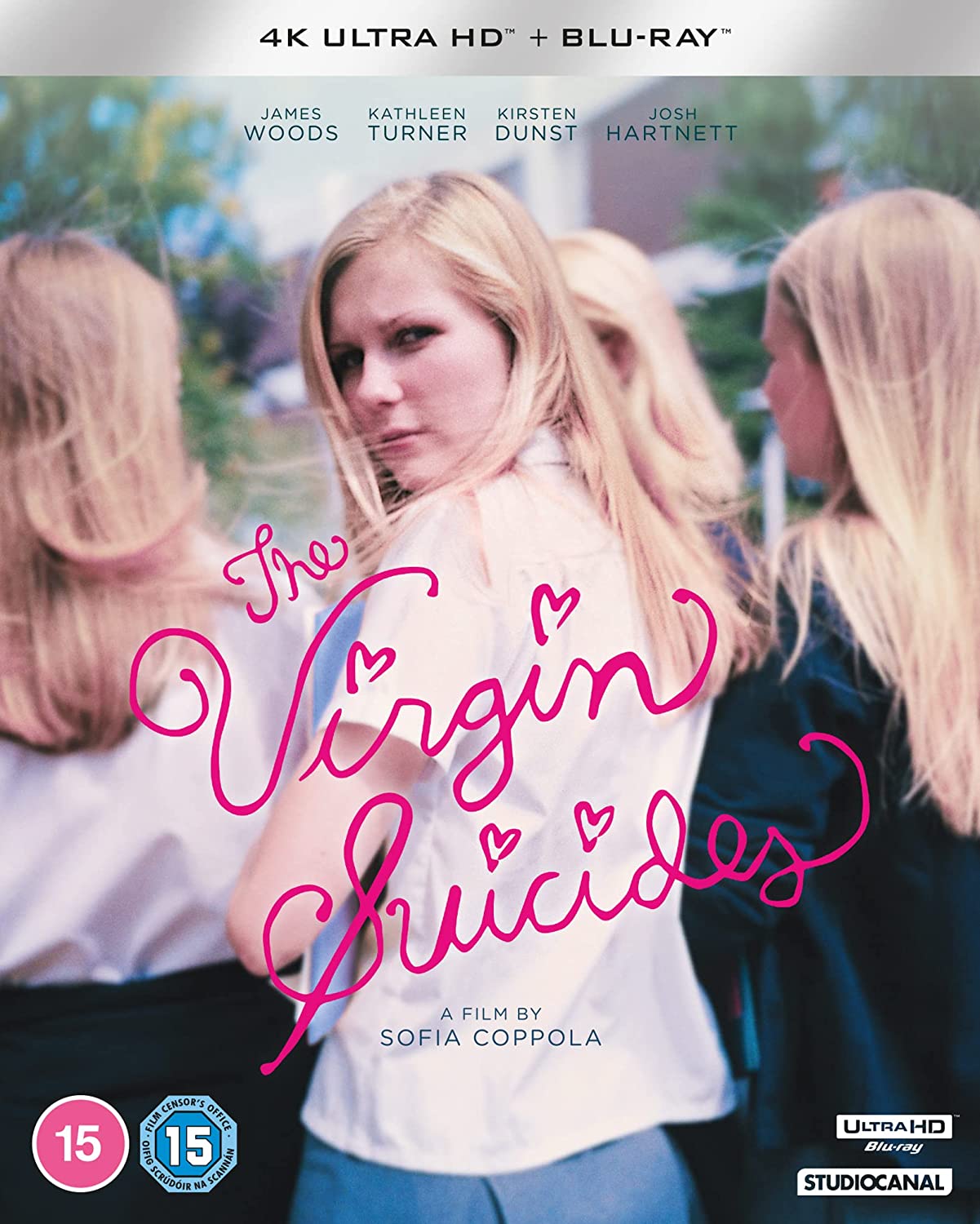 "Blonde girl in white shirt with 'The Virgin Suicides' title in pink script."