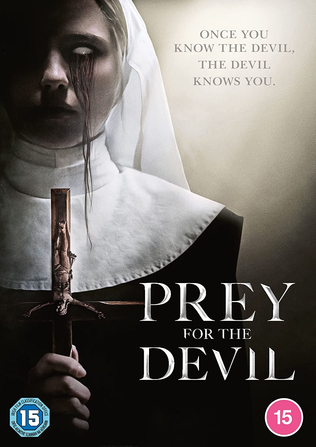 "Prey for the Devil" DVD cover featuring a nun holding a crucifix with a demon inside.