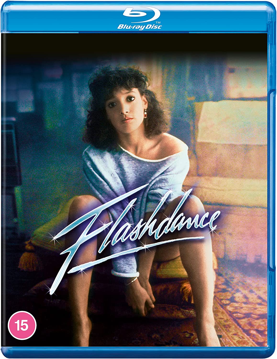 "Blu-ray case with a woman sitting on a couch, wearing an off-the-shoulder sweater."