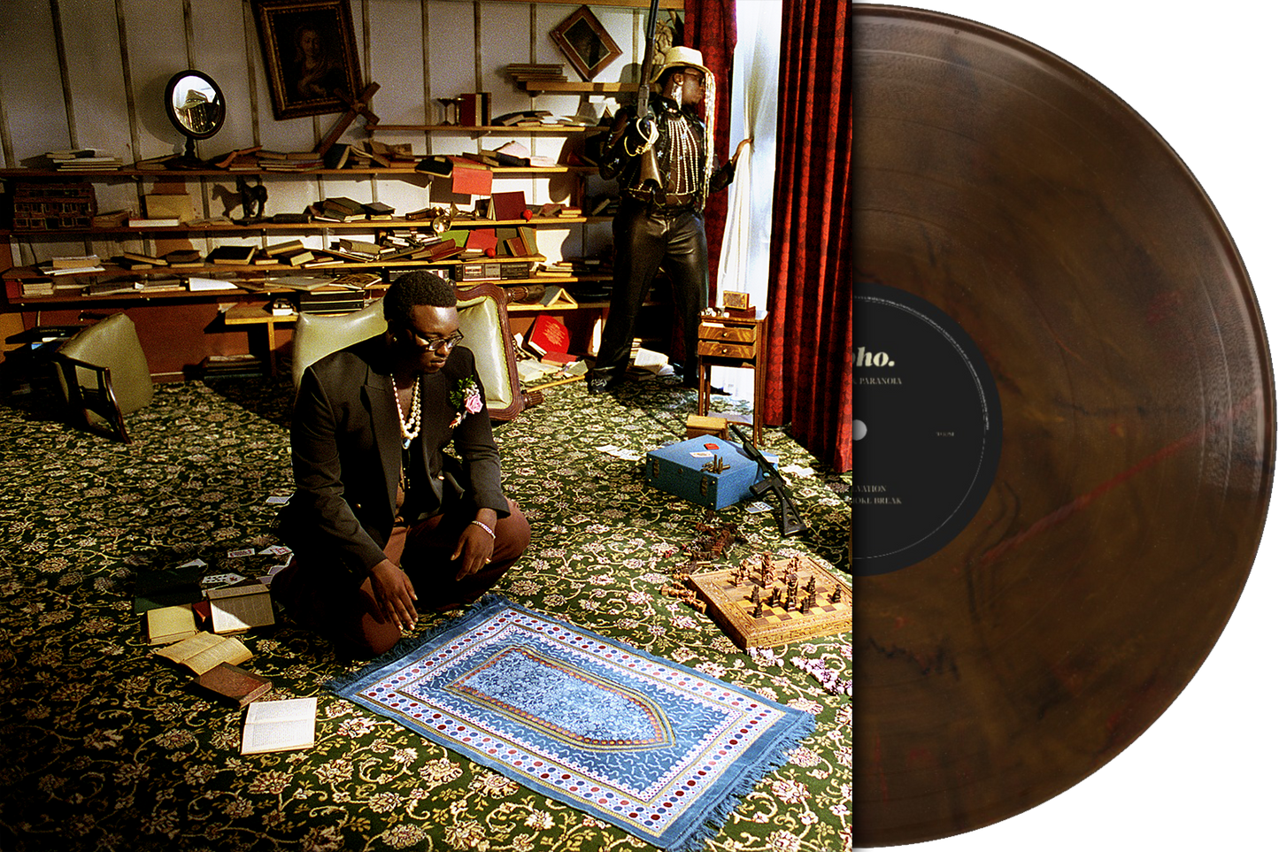 "Brown vinyl record with black label, partially covering an image of two men."