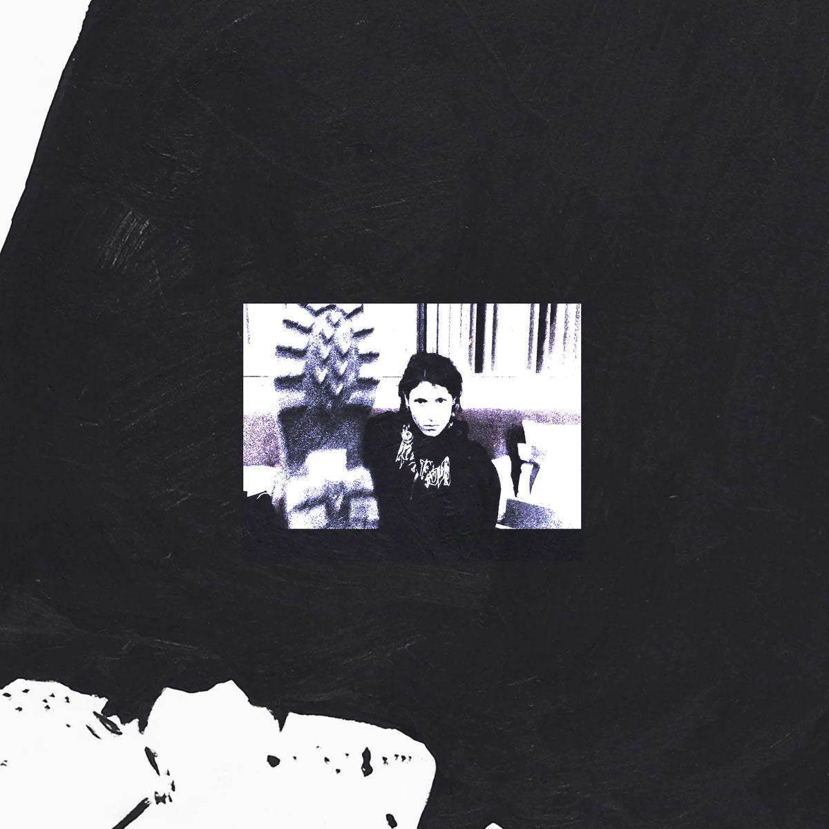 Black and white vinyl record cover featuring a portrait of a person.