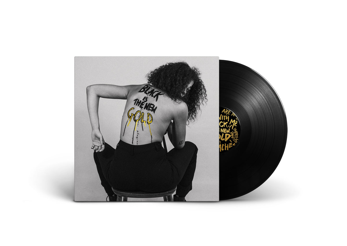 "Vinyl record sleeve with a black and white photo of a woman's back."