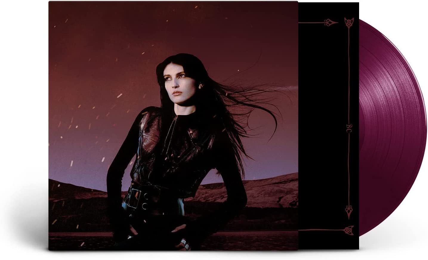 Vinyl record with black cover featuring a woman and purple vinyl disc.