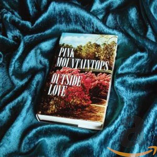 CD case for Pink Mountaintops’ “Outside Love” album on blue fabric.